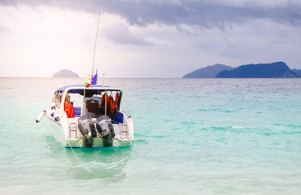 Exotic beautiful marine beach of Antigua St. Johns with boat on blue water and sky with small clouds - Boost up color Processing., Exotic beautiful marine beach of Antigua St. Johns with boat on RWG